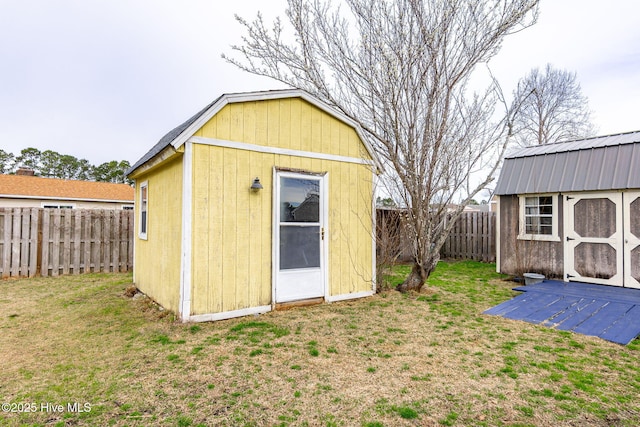 view of shed featuring a fenced backyard