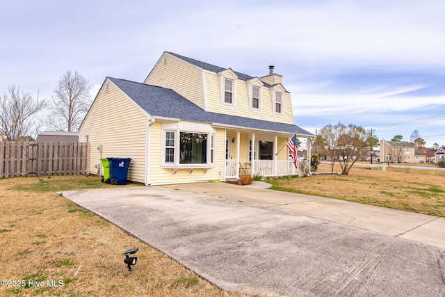 view of front of house with a front yard, fence, a porch, a shingled roof, and a chimney