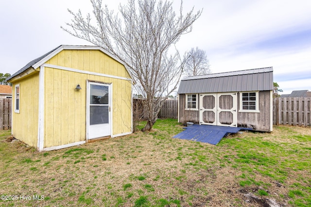 view of shed with a fenced backyard