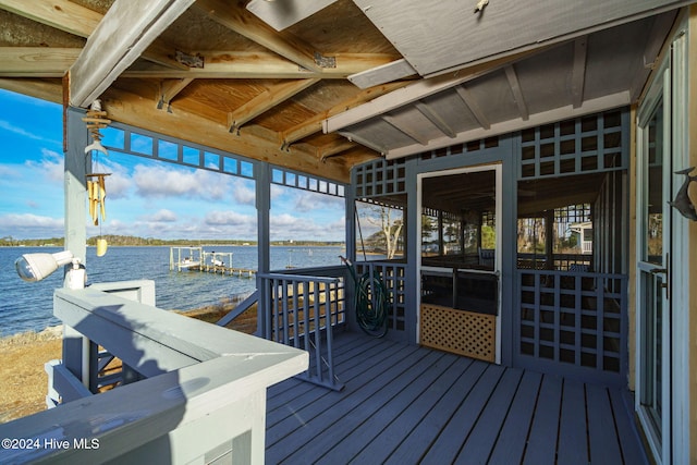 deck with a boat dock and a water view