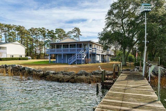 dock area with a water view and stairs