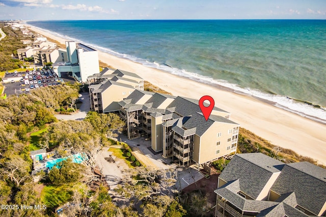 drone / aerial view featuring a view of the beach and a water view