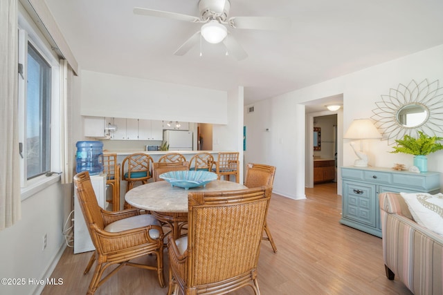 dining area featuring ceiling fan and light hardwood / wood-style floors