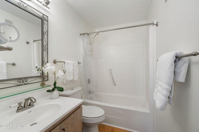 full bathroom featuring vanity, wood-type flooring, shower / tub combo with curtain, and toilet