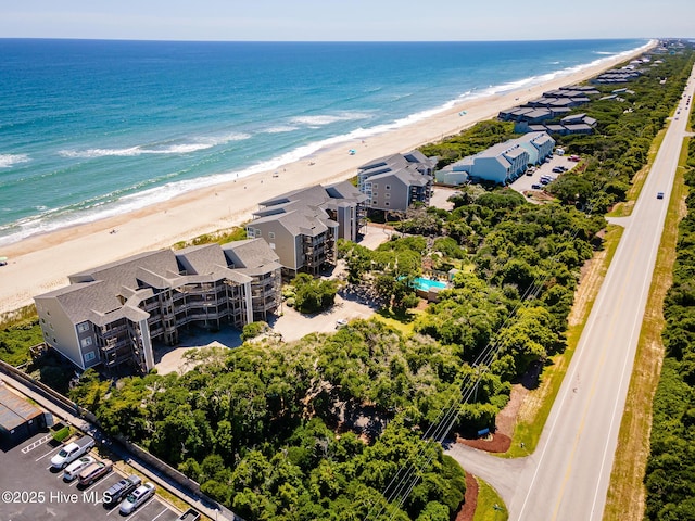 aerial view featuring a view of the beach and a water view