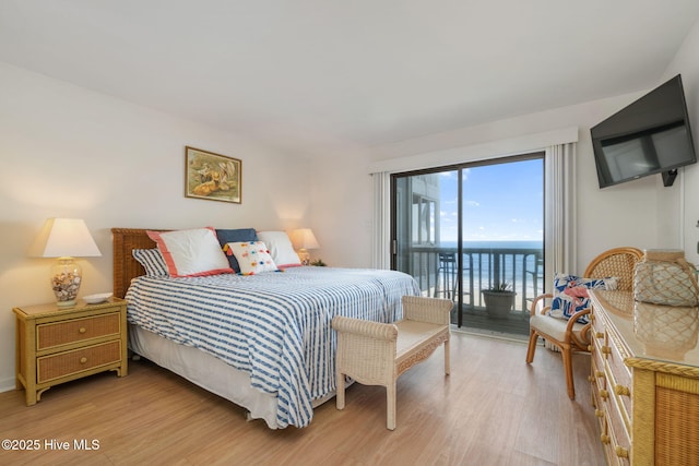 bedroom featuring access to outside and light wood-type flooring