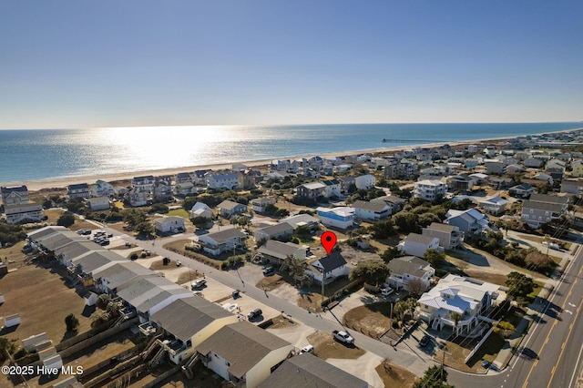 aerial view featuring a view of the beach and a water view