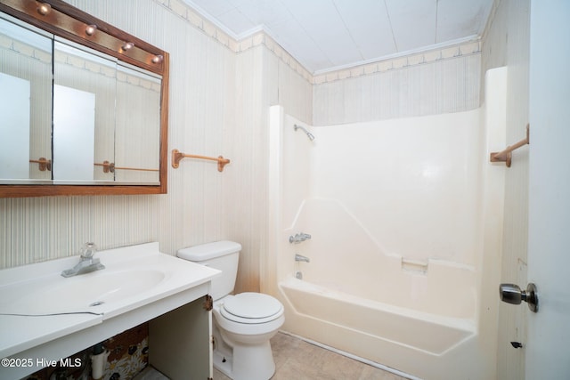 full bathroom with vanity, ornamental molding, bathing tub / shower combination, and toilet