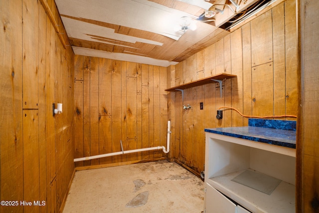 washroom with wooden walls