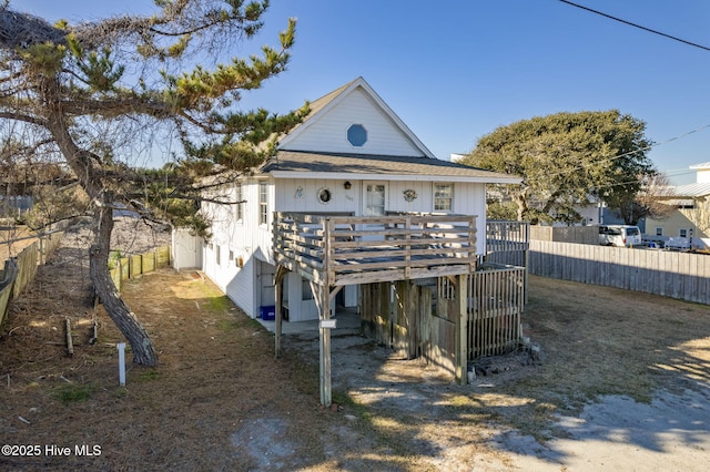 back of property featuring a deck