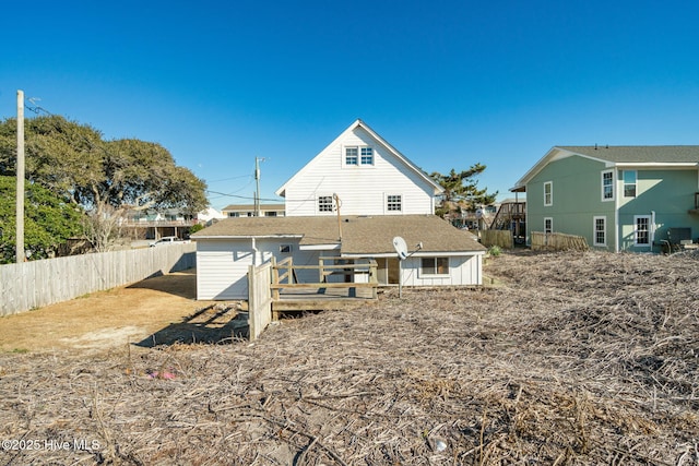 rear view of property with a wooden deck