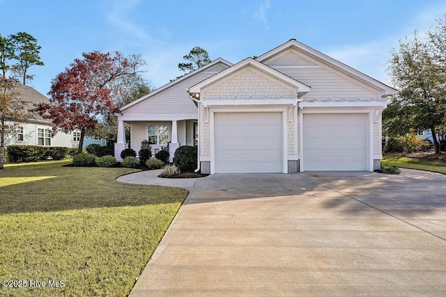 view of front of home featuring a porch, a garage, and a front yard