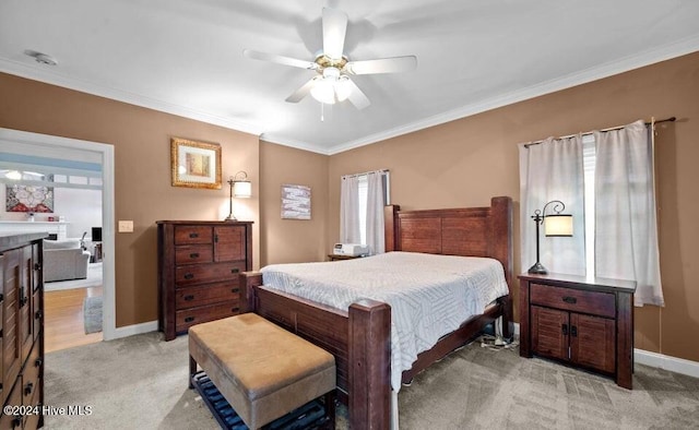 carpeted bedroom with ceiling fan, crown molding, and multiple windows