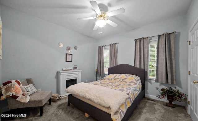 carpeted bedroom with ceiling fan