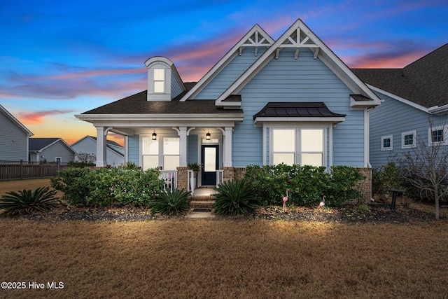 craftsman house featuring a lawn and a porch