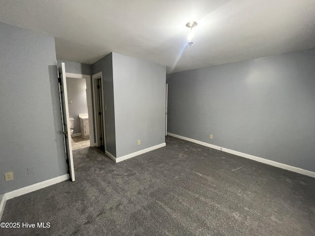 unfurnished bedroom featuring dark colored carpet