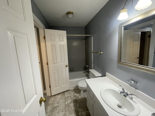 full bathroom featuring vanity, toilet, and tiled shower / bath