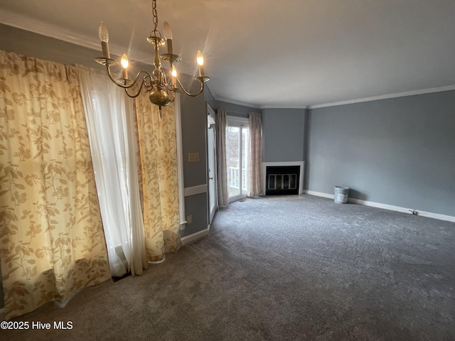 unfurnished living room with crown molding, dark carpet, and an inviting chandelier