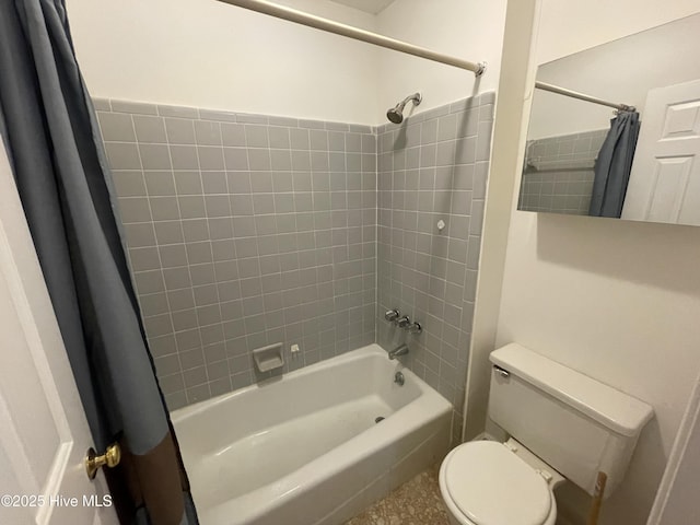 bathroom with toilet and shower / bath combo