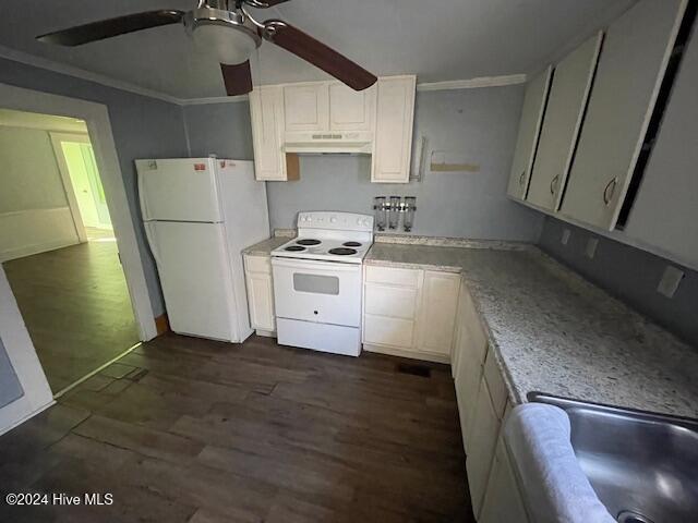 kitchen featuring white cabinets, dark hardwood / wood-style flooring, white appliances, and ornamental molding