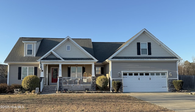 craftsman-style home with a porch and a garage