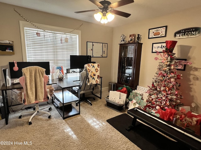 office area with carpet floors and ceiling fan