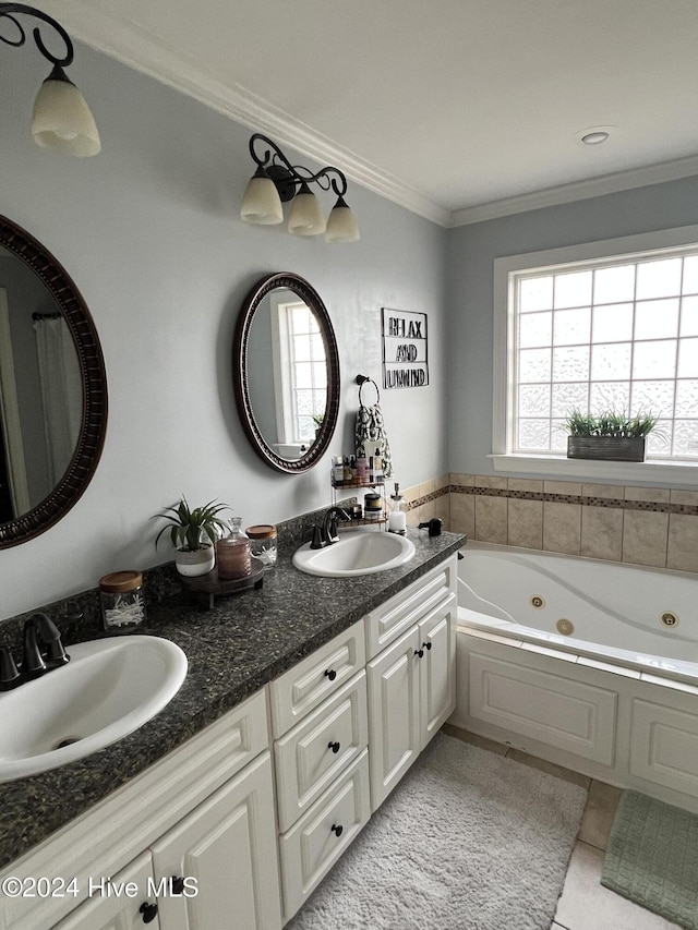 bathroom featuring a bathing tub, crown molding, tile patterned flooring, and vanity