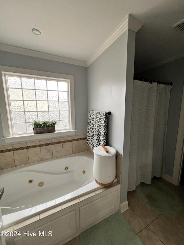 bathroom with a tub to relax in, tile patterned flooring, and ornamental molding