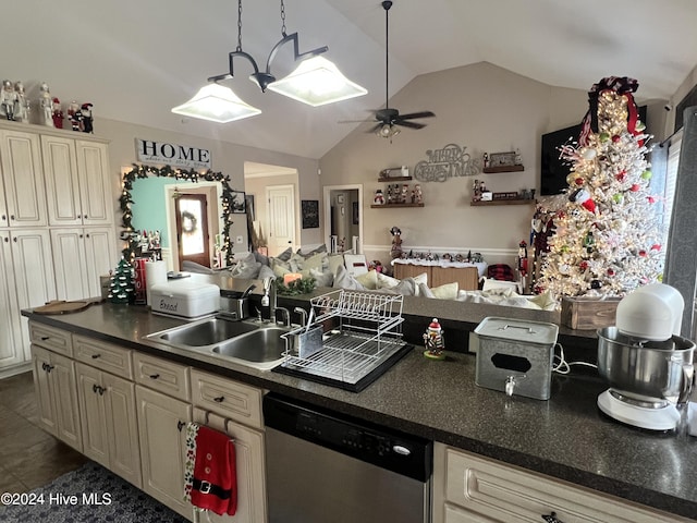 kitchen featuring ceiling fan, sink, cream cabinets, dishwasher, and lofted ceiling