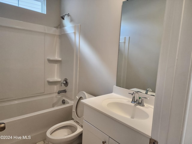 full bathroom with vanity, toilet, and shower / washtub combination