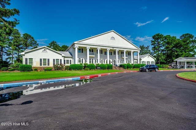 view of front of house featuring a front lawn and a porch