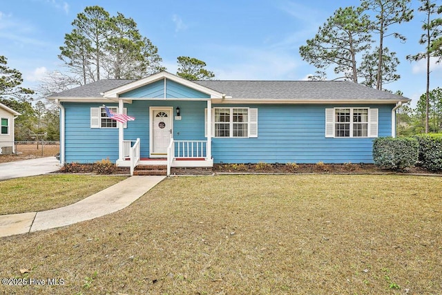 view of front facade with a front yard and covered porch