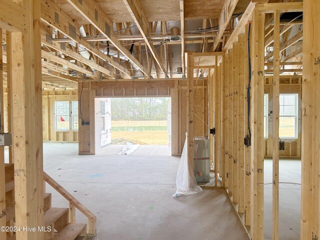 living room with french doors, high vaulted ceiling, and built in features