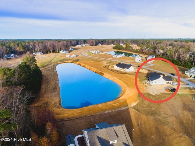 view of pool featuring a water view