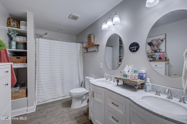 bathroom with hardwood / wood-style floors, vanity, toilet, and a shower with curtain