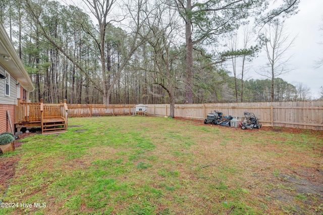 view of yard with a wooden deck