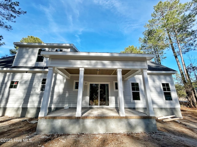 rear view of house with a porch