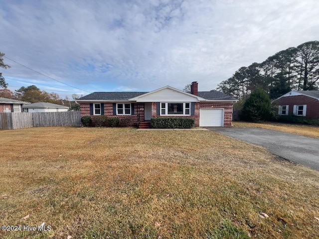 ranch-style house with a front yard and a garage