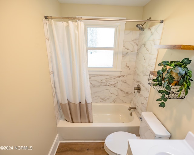 bathroom with wood-type flooring, shower / bath combination with curtain, and toilet