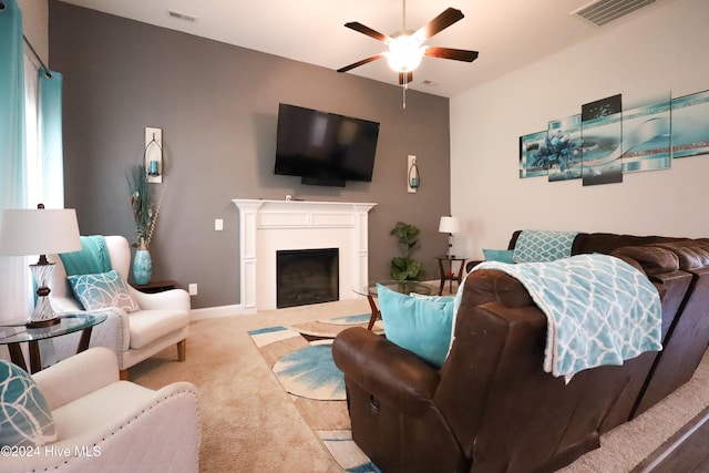 living room with light carpet and ceiling fan