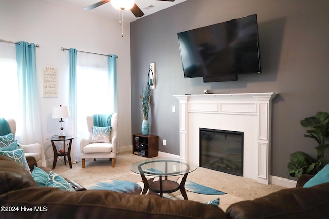 carpeted living room featuring ceiling fan