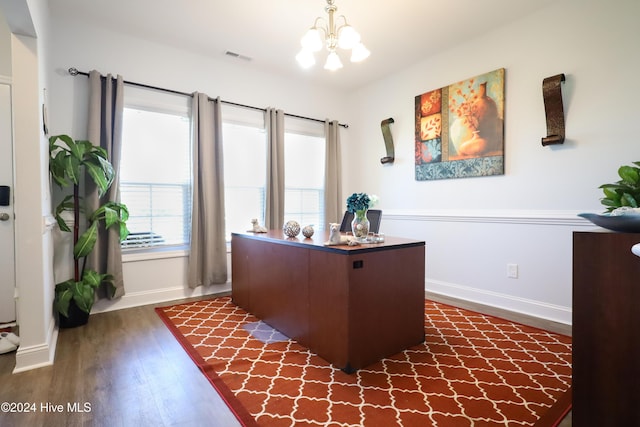 home office featuring dark hardwood / wood-style flooring and a chandelier