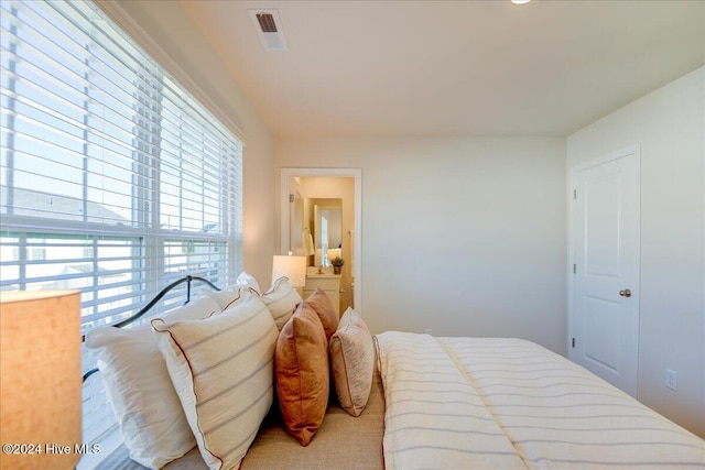 bedroom with multiple windows