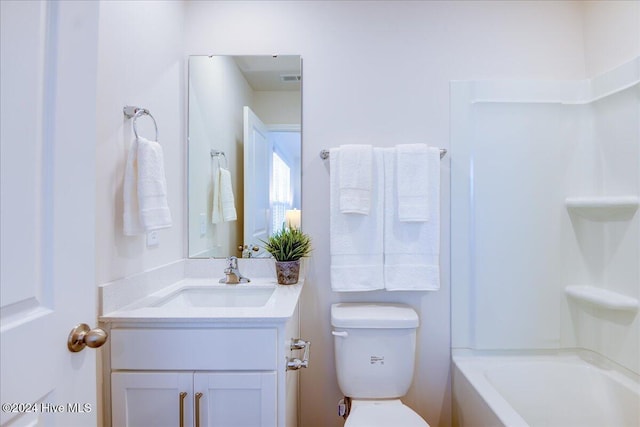 bathroom featuring visible vents, vanity, and toilet