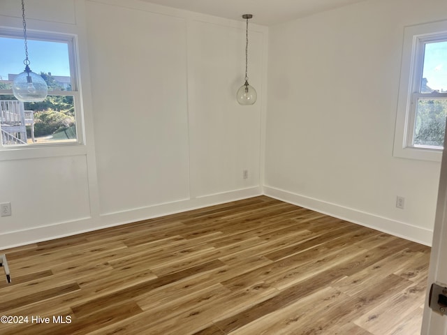 unfurnished room featuring wood-type flooring