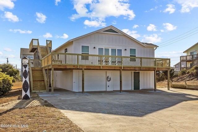 view of front of home featuring a deck and a garage