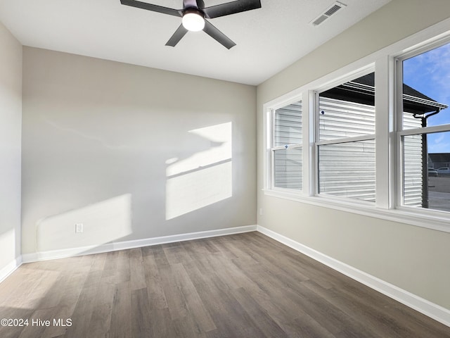 empty room featuring hardwood / wood-style flooring and ceiling fan