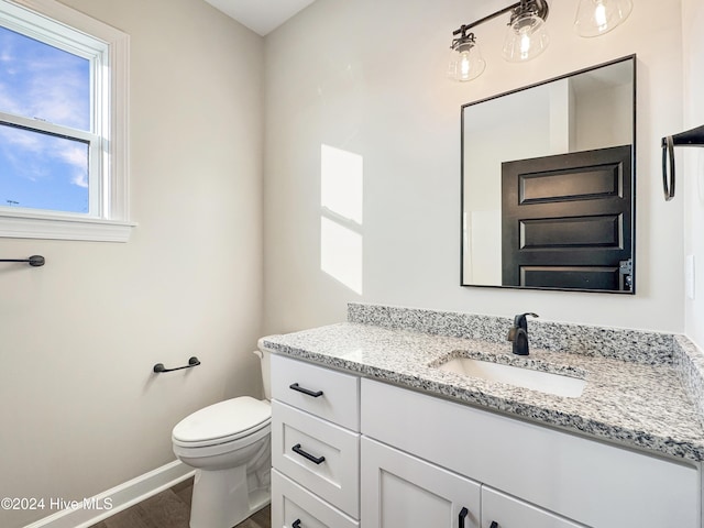 bathroom with vanity and toilet