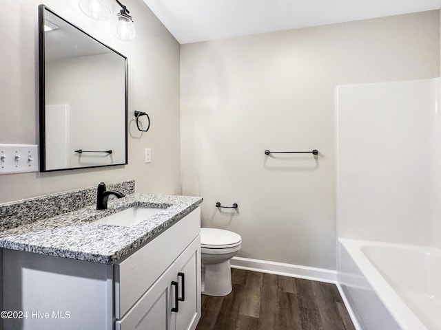 bathroom featuring hardwood / wood-style floors, vanity, and toilet