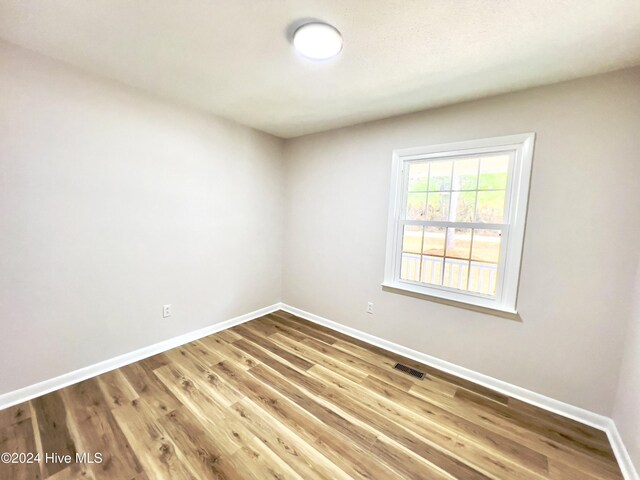 laundry room with washer hookup and water heater